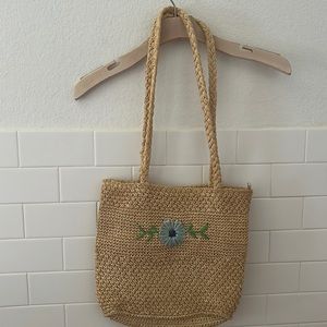 Vintage straw purse with embroidered flower